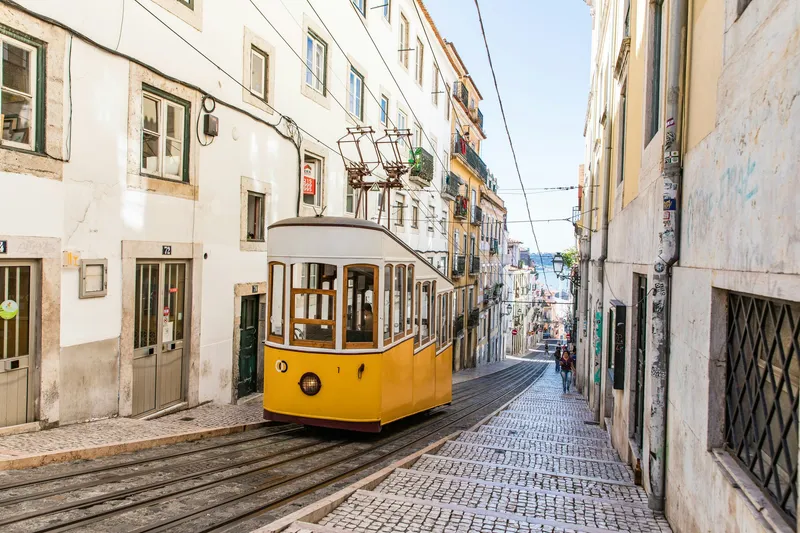 Vintage yellow tram on a historic Lisbon street