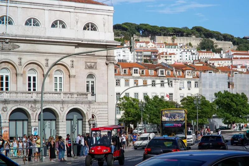 Yellow Bus Tours Lisbon open-top double-decker bus on a busy street